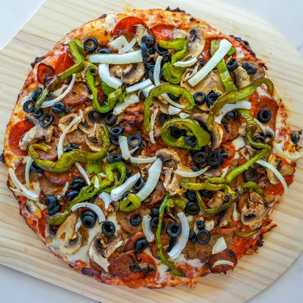 A RigaTony's pizza with pepperoni, sausage, mushrooms, green peppers, onions, and black olives.